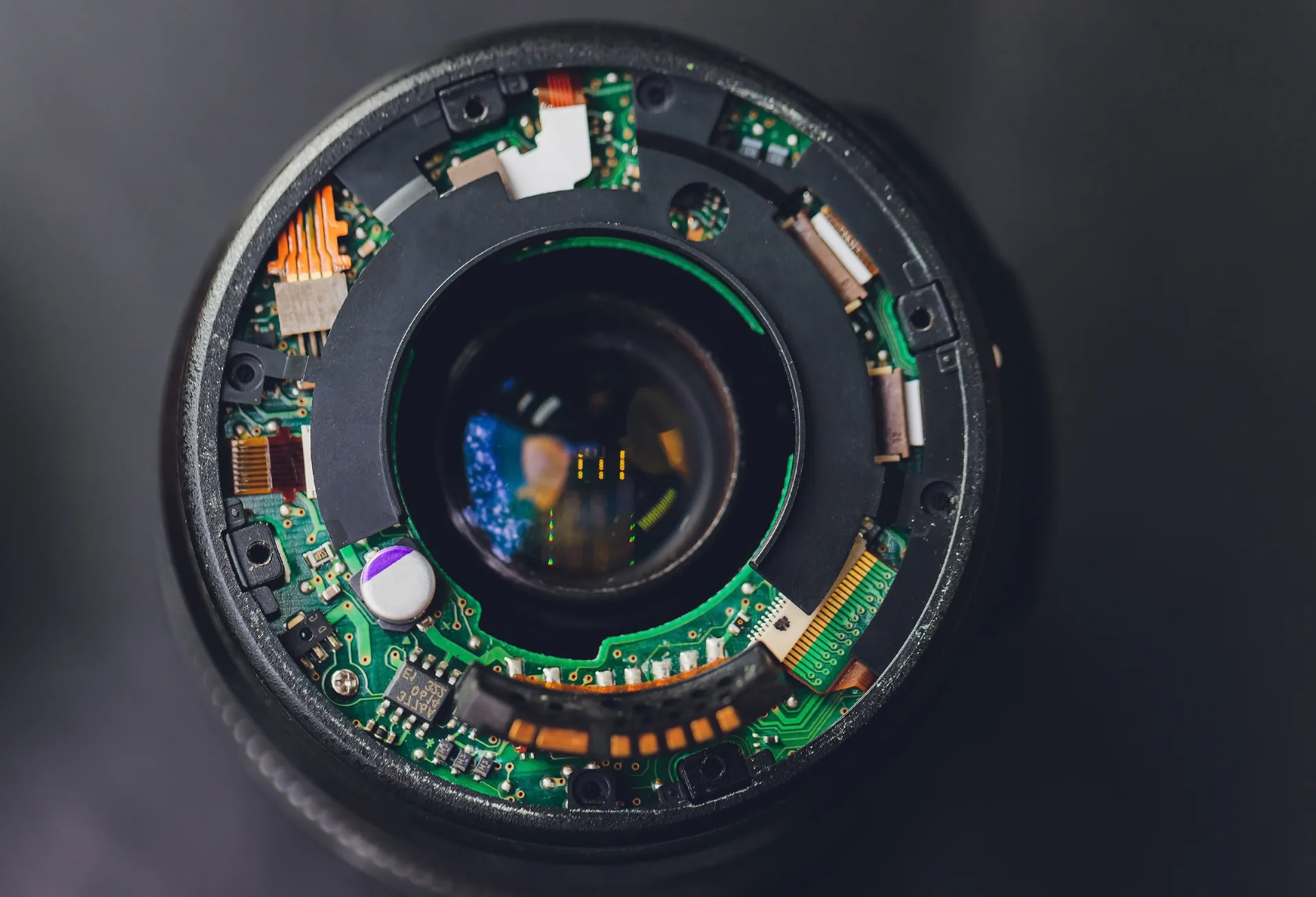 Camera retaining spring assembly solution